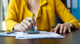 vecteezy_woman-stamping-a-document_1401471