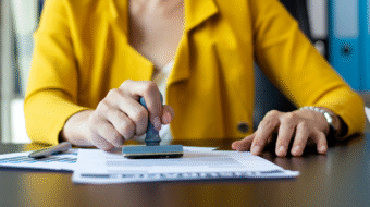 vecteezy_woman-stamping-a-document_1401471