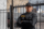 portrait-male-security-guard-with-barbed-wire-fence